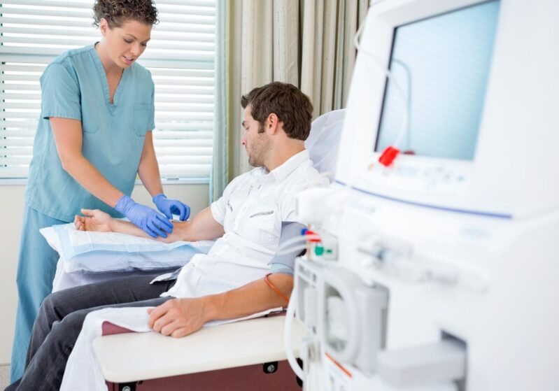 man hooked up to dialysis machine